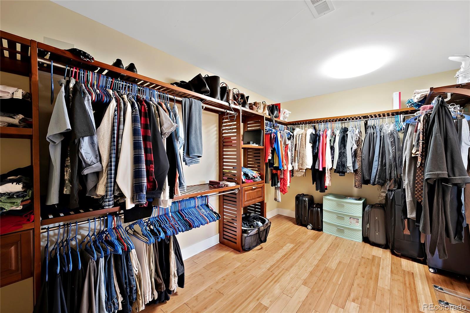 16520 East Easter Way Foxfield, CO 80016 - Photo 20 of 38 a view of walk in closet with clothes and shoes