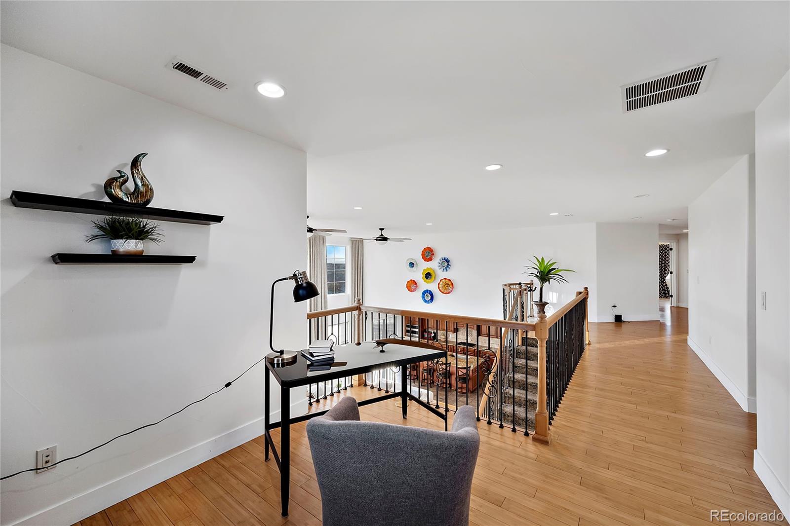 16520 East Easter Way Foxfield, CO 80016 - Photo 22 of 38 a view of a dining room with furniture and wooden floor
