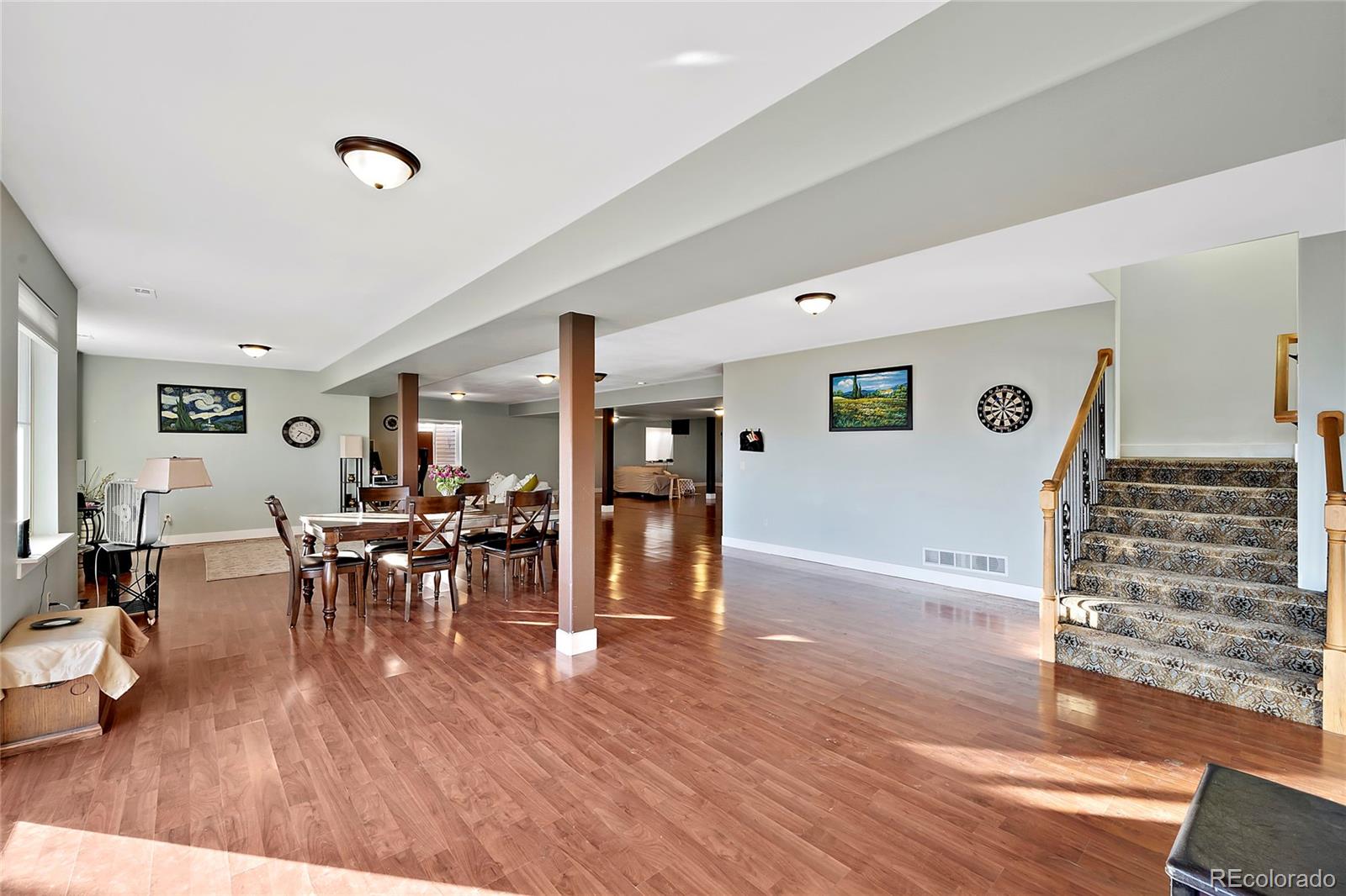 16520 East Easter Way Foxfield, CO 80016 - Photo 34 of 38 a living room with furniture and wooden floor