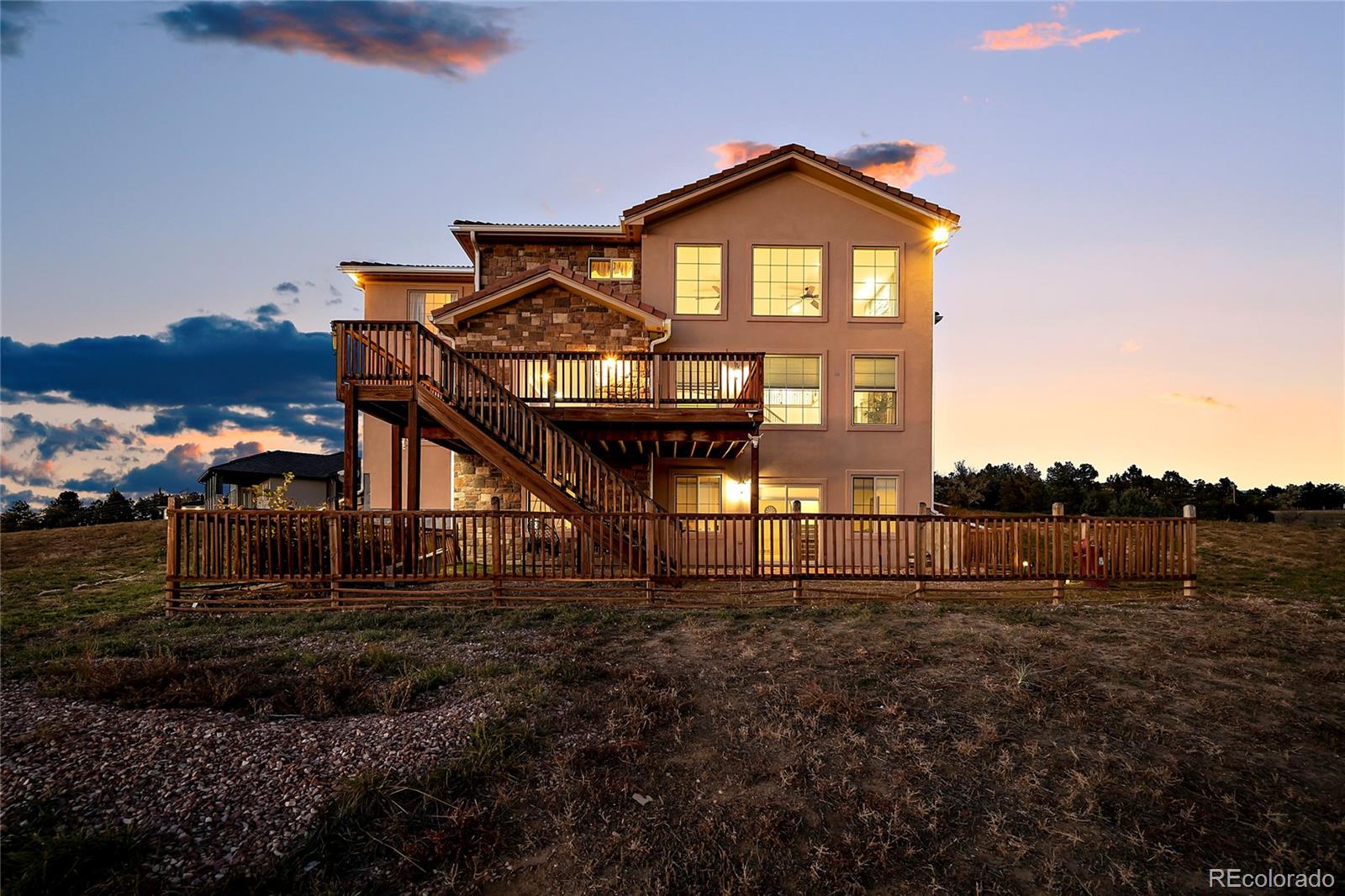 16520 East Easter Way Foxfield, CO 80016 - Photo 36 of 38 a front view of a house with a yard