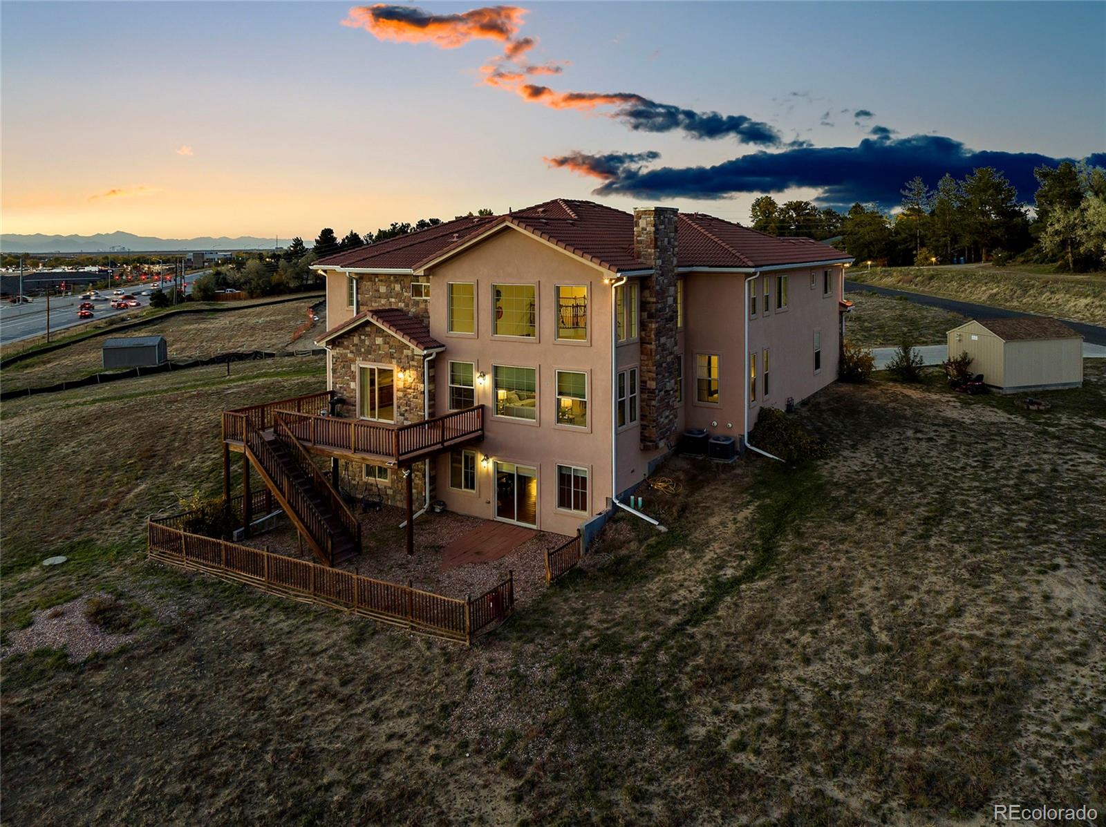 16520 East Easter Way Foxfield, CO 80016 - Photo 38 of 38 a view of a house with a yard