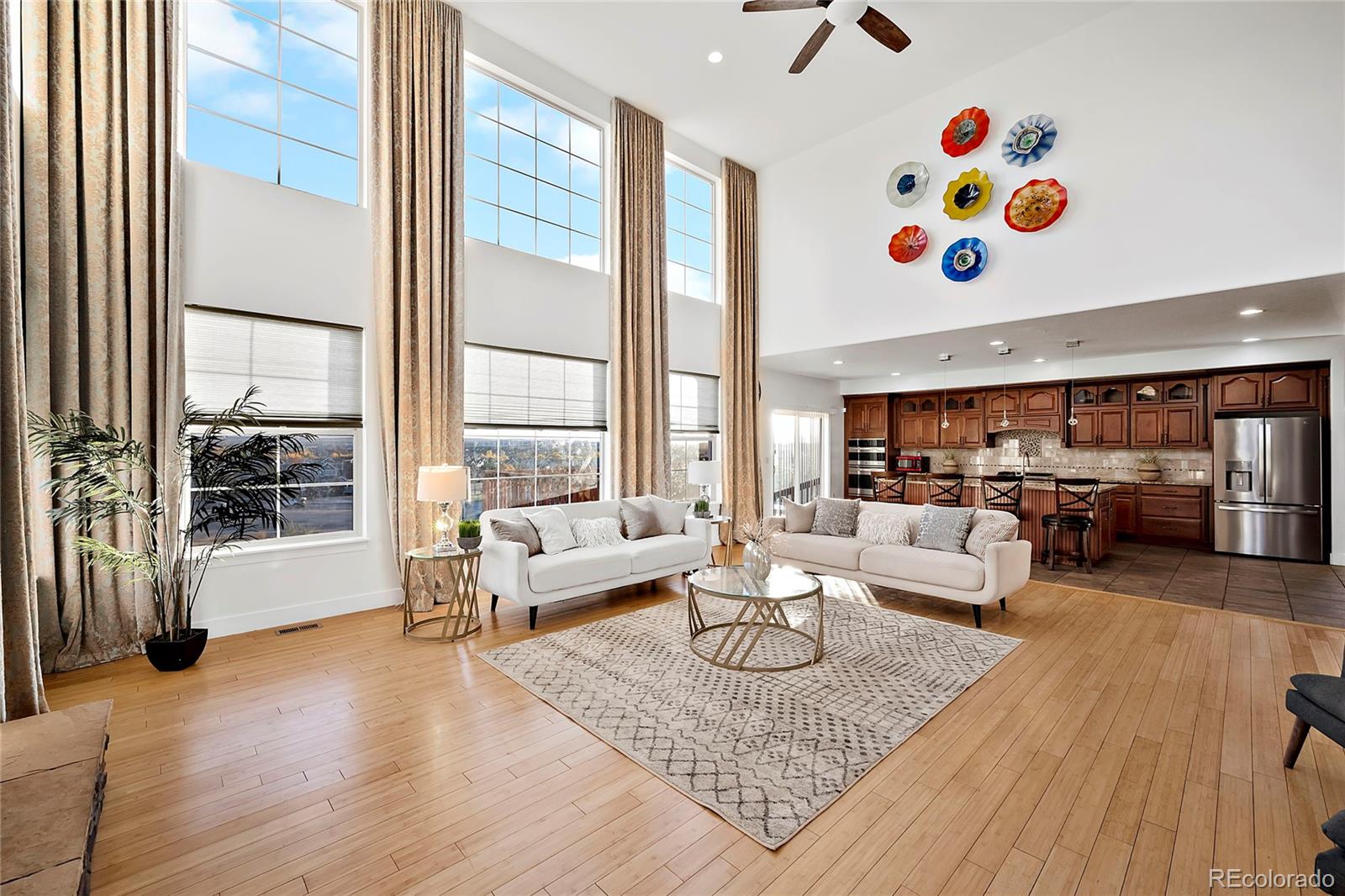 16520 East Easter Way Foxfield, CO 80016 - Photo 6 of 38 a living room with patio and a couch
