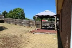 a view of a swimming pool with a bench