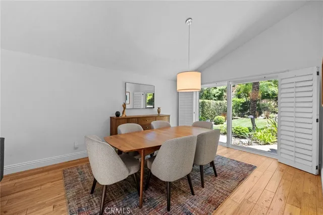a living room with furniture a rug and a large window