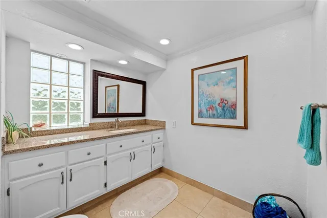 a view of a workspace with furniture and a flat screen tv