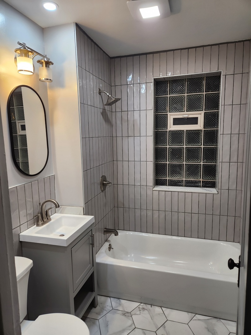 7443 South Wabash Avenue Chicago, IL 60619 - Photo 7 of 10 a bathroom with a sink toilet and shower