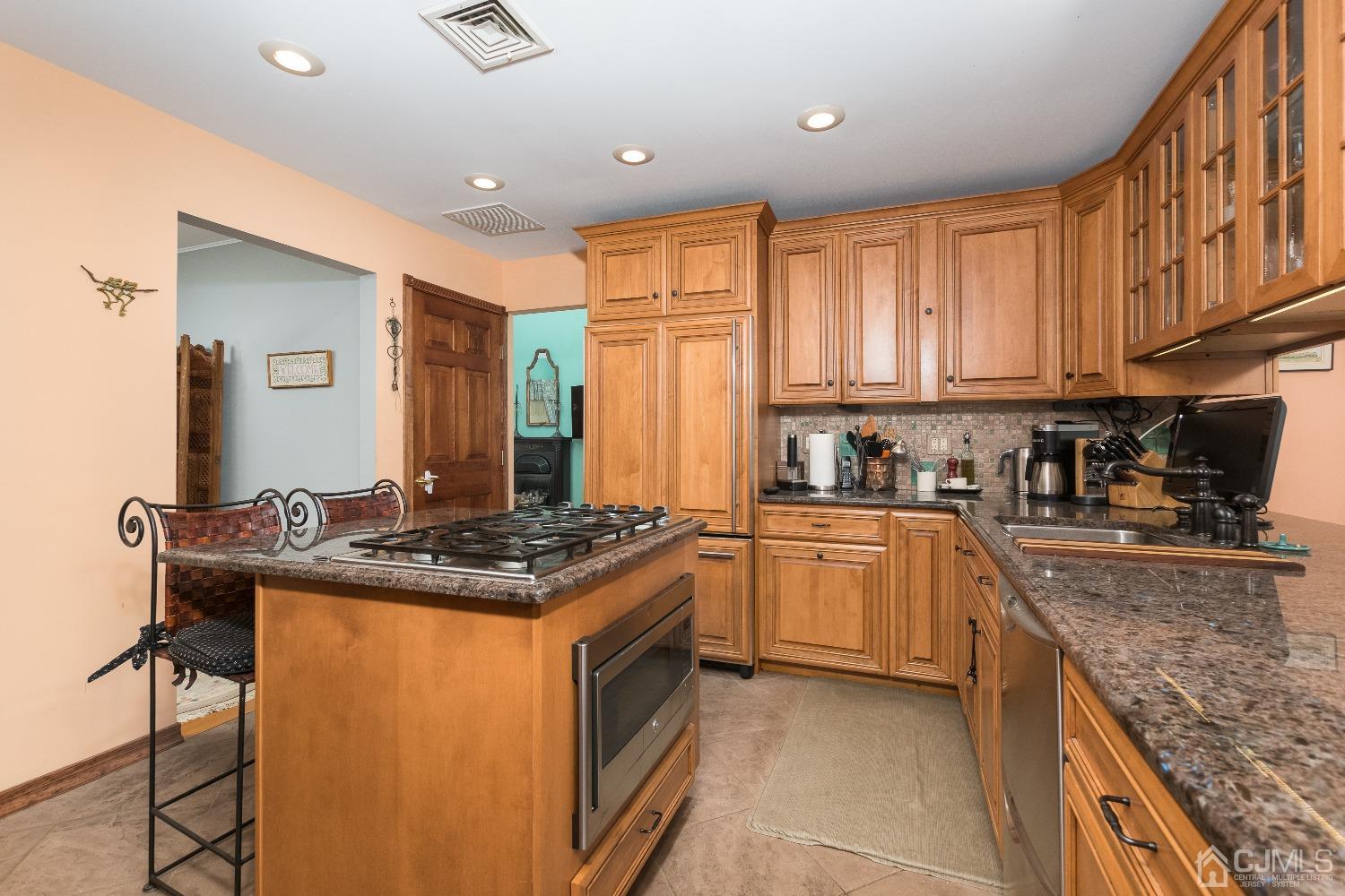 1 Holmes Road Cranbury, NJ 08512 - Photo 15 of 39 a kitchen with stainless steel appliances granite countertop a stove a sink and a refrigerator