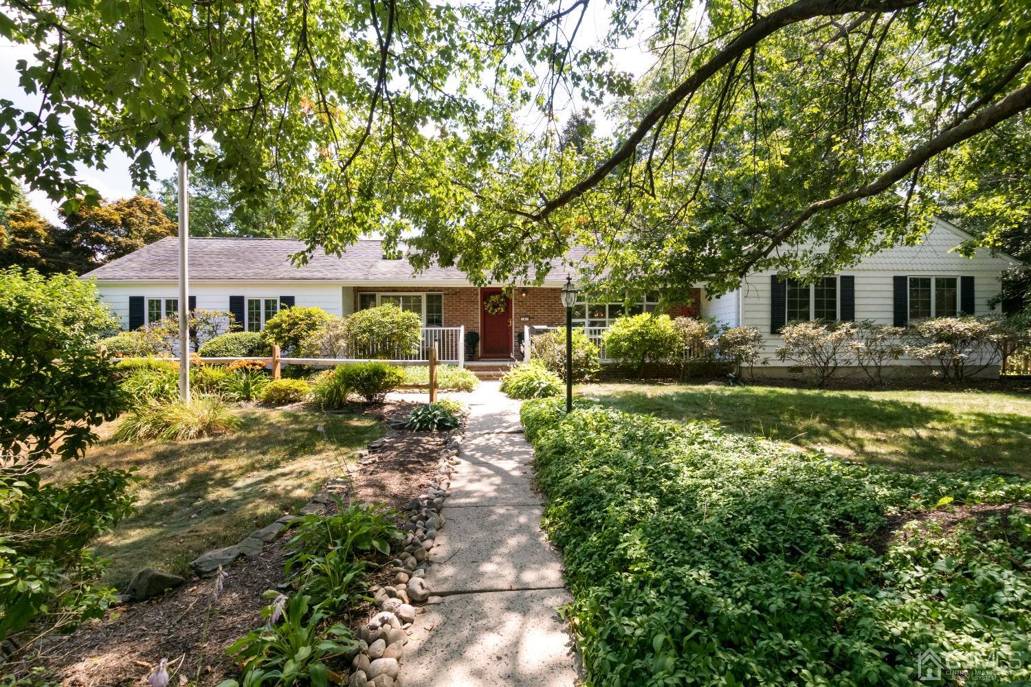 1 Holmes Road Cranbury, NJ 08512 - Photo 39 of 39 a front view of a house with garden