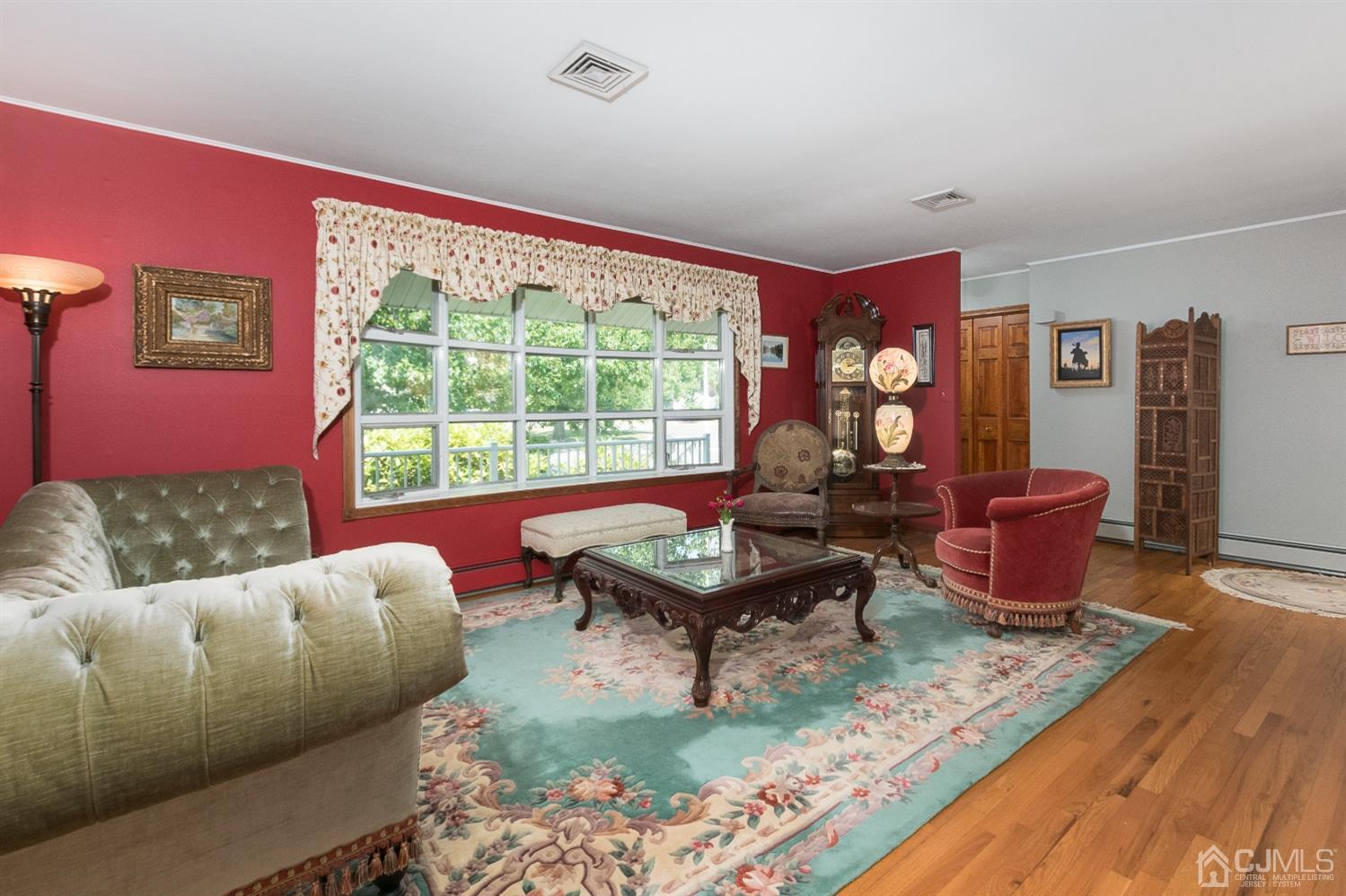 1 Holmes Road Cranbury, NJ 08512 - Photo 4 of 39 a living room with furniture and a floor to ceiling window