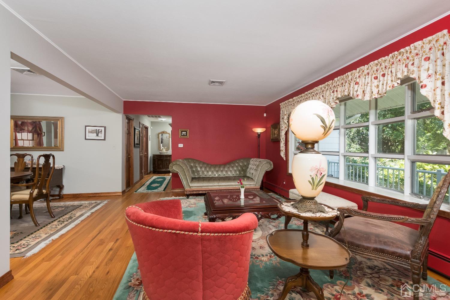 1 Holmes Road Cranbury, NJ 08512 - Photo 5 of 39 a living room with furniture and a large window