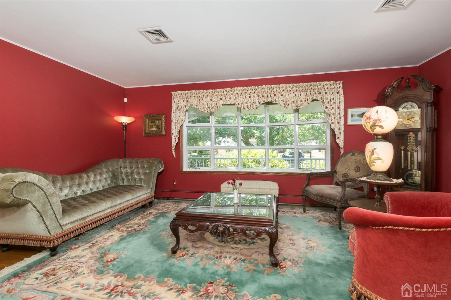 1 Holmes Road Cranbury, NJ 08512 - Photo 7 of 39 a living room with furniture and a large window
