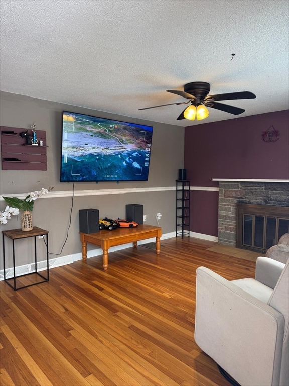 22 Falcon Street Methuen, MA 01844 - Photo 2 of 12 a living room with furniture and a wooden floor