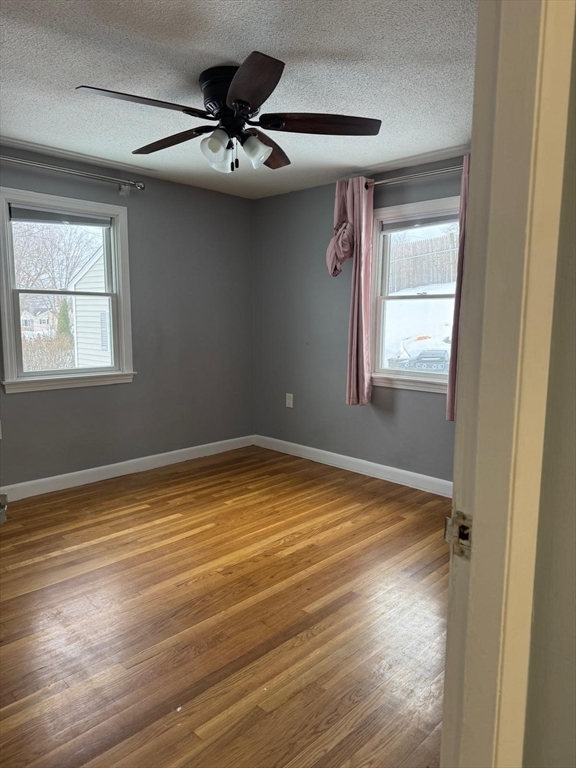 22 Falcon Street Methuen, MA 01844 - Photo 5 of 12 a view of a livingroom with a ceiling fan and window