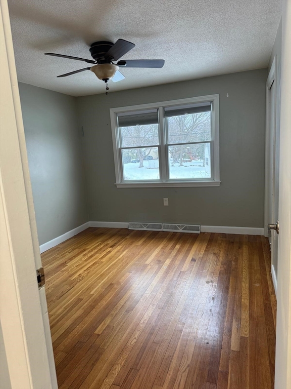 22 Falcon Street Methuen, MA 01844 - Photo 6 of 12 wooden floor in an empty room