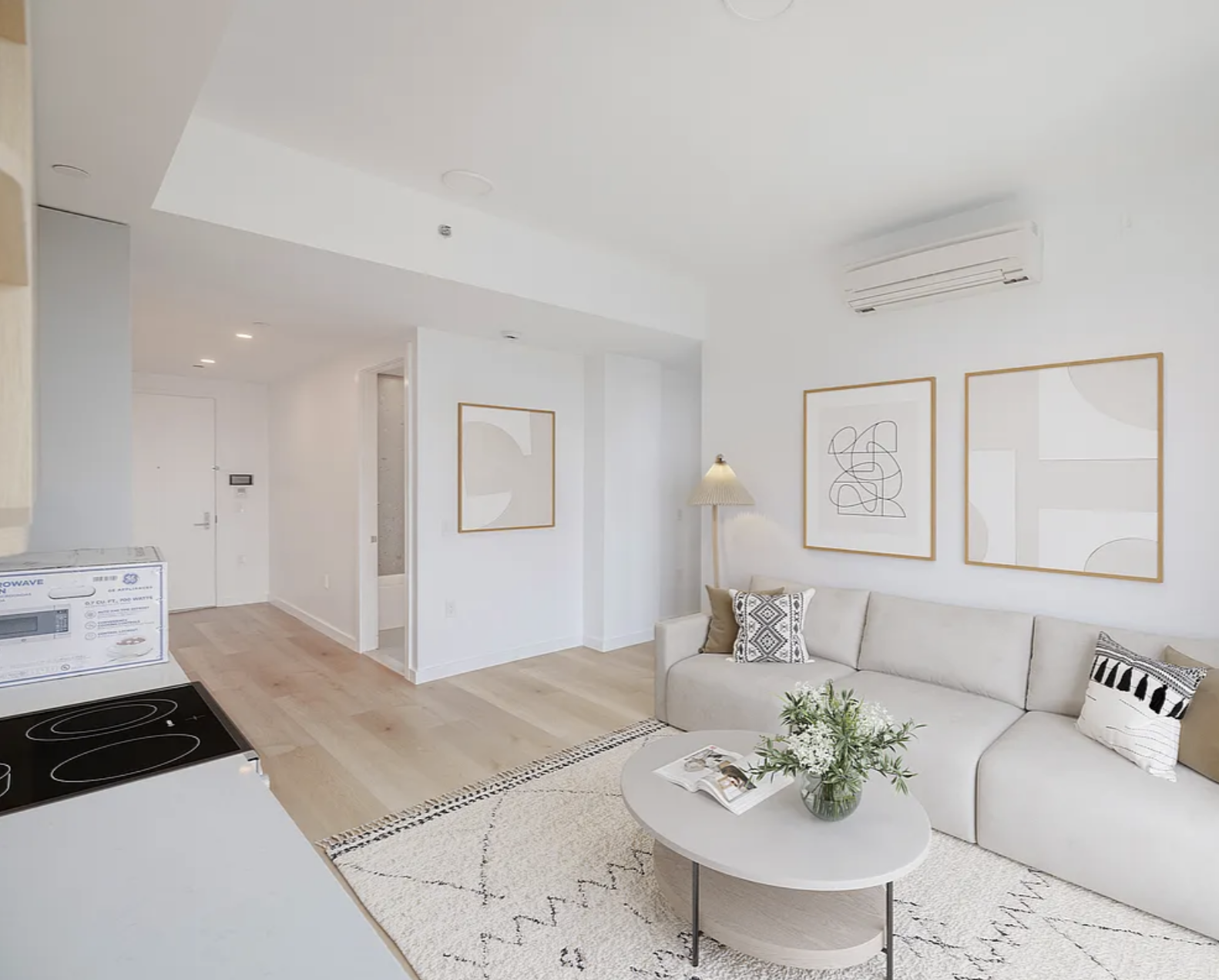 1889 Atlantic Avenue, Unit 9E Brooklyn, NY 11233 - Photo 3 of 9 a living room with furniture and a table