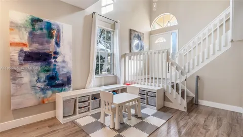 a view of a livingroom with furniture and front door