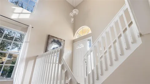 a view of staircase with rug