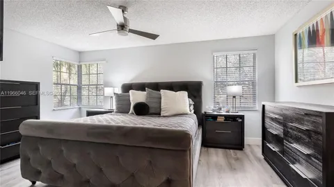 a bedroom with a bed and a fireplace