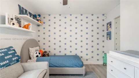 a living room with a couch and a dresser