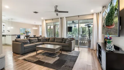 a living room with furniture and a large window
