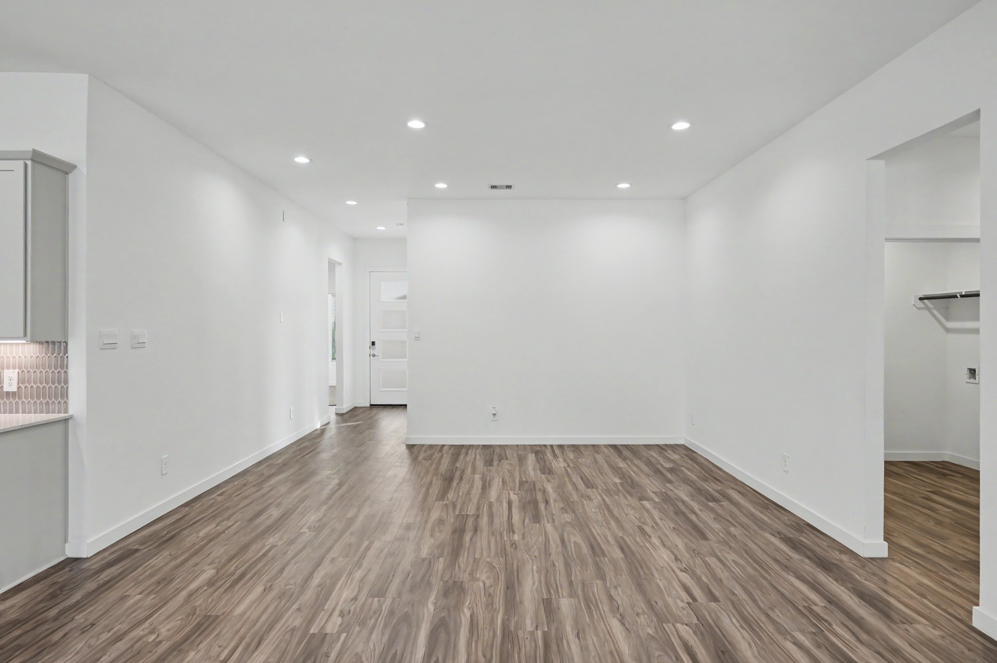 14162 Primrose Ridge Lane Conroe, TX 77384 - Photo 15 of 48 Bright and open living space featuring sleek, modern flooring and recessed lighting, perfect for customization.