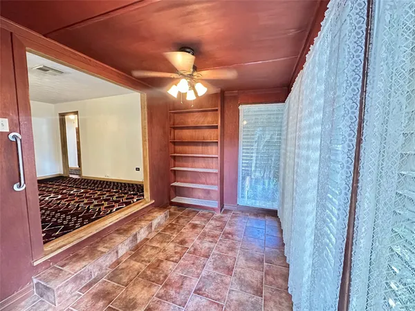 a view of closet with wooden floor