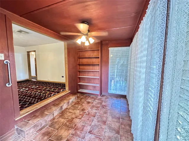 a view of closet with wooden floor