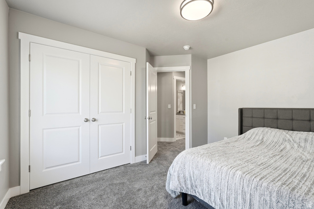 2216 South 1150 West Nibley, UT 84321 - Photo 29 of 34 Bedroom with gray carpeting and a contemporary ceiling light fixture