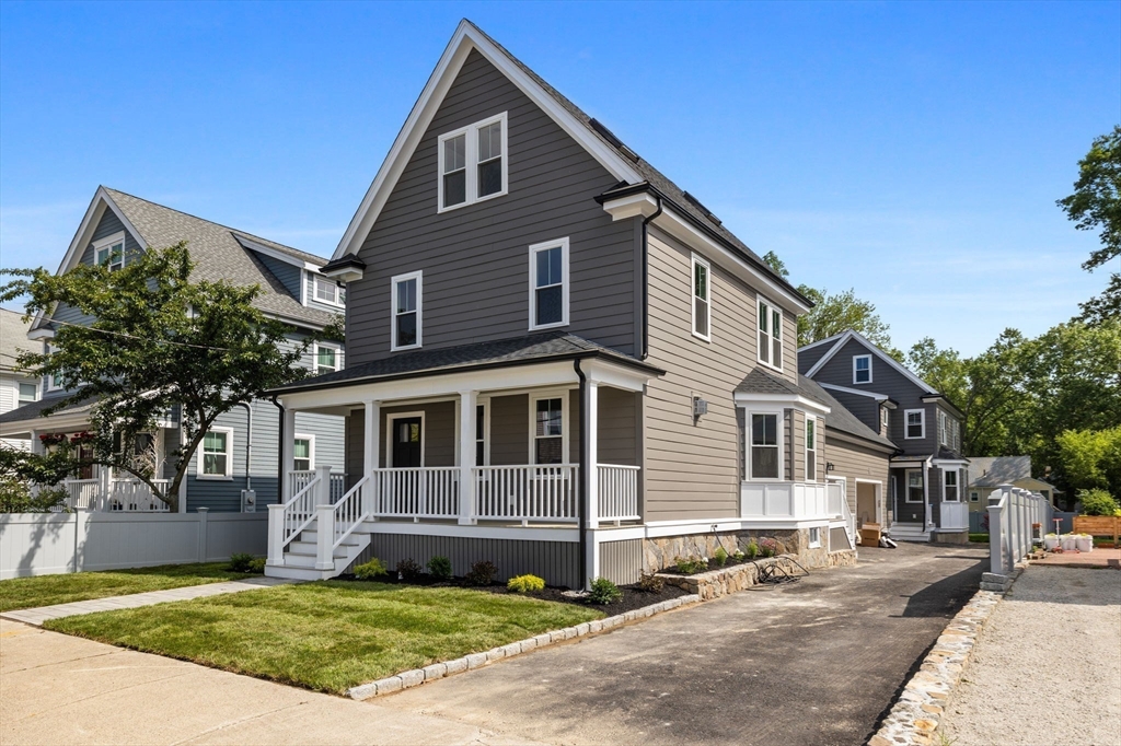 73 R Knoll Street, Unit 73R Boston, MA 02131 - Photo 11 of 11 a front view of a house with a yard