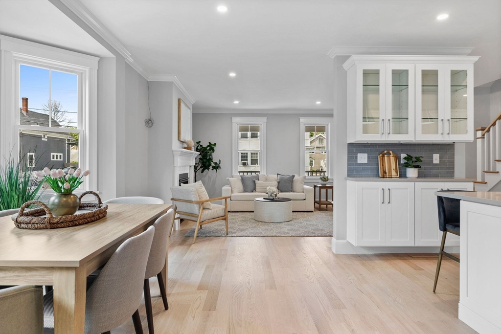 73 R Knoll Street, Unit 73R Boston, MA 02131 - Photo 2 of 11 a living room with furniture and wooden floor