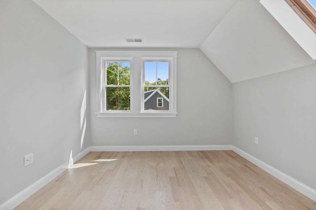 73 R Knoll Street, Unit 73R Boston, MA 02131 - Photo 9 of 11 an empty room with a window
