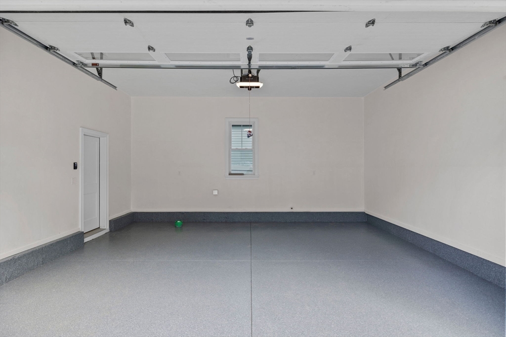 73 R Knoll Street, Unit 73R Boston, MA 02131 - Photo 10 of 11 a view of a utility room with racks on the wall