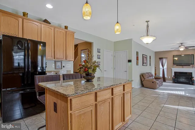 a kitchen with sink refrigerator and microwave