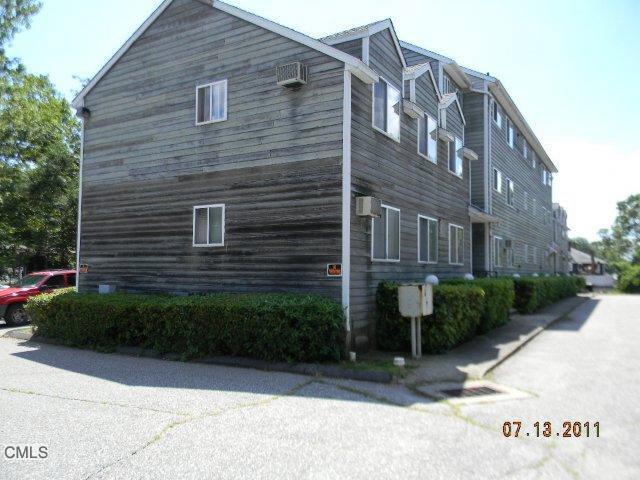 655 Success Avenue, Unit 3 Stratford, CT 06614 - Photo 1 of 1 a view of a brick building next to a yard