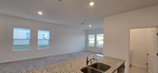 a view of entryway with kitchen