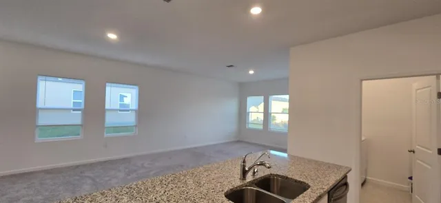 a view of entryway with kitchen