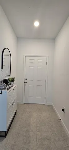 an empty room that has a large window