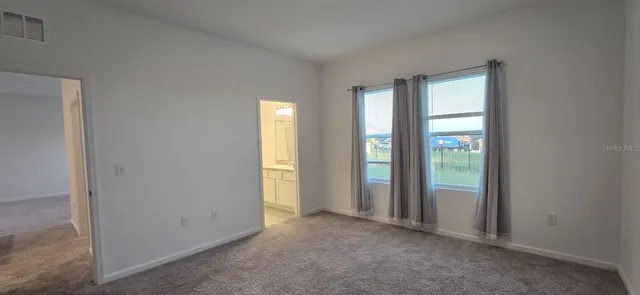 a kitchen with granite countertop a sink and cabinets