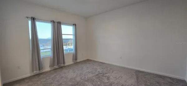 a view of kitchen and kitchen with windows