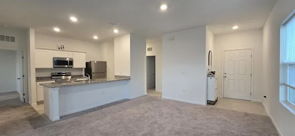 a view of an empty room and window