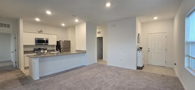 a view of an empty room and window