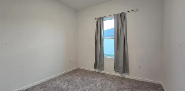 an empty room with window