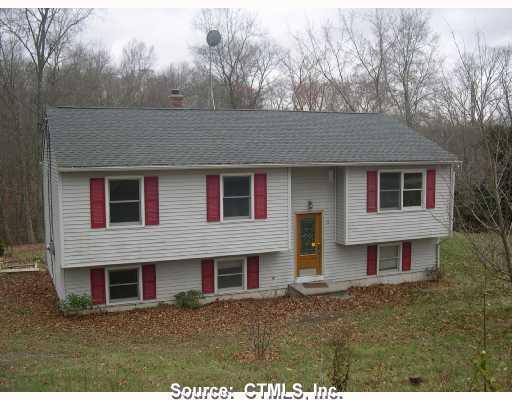 71 Hanover Road Scotland, CT 06330 - Photo 1 of 1 a front view of house with yard