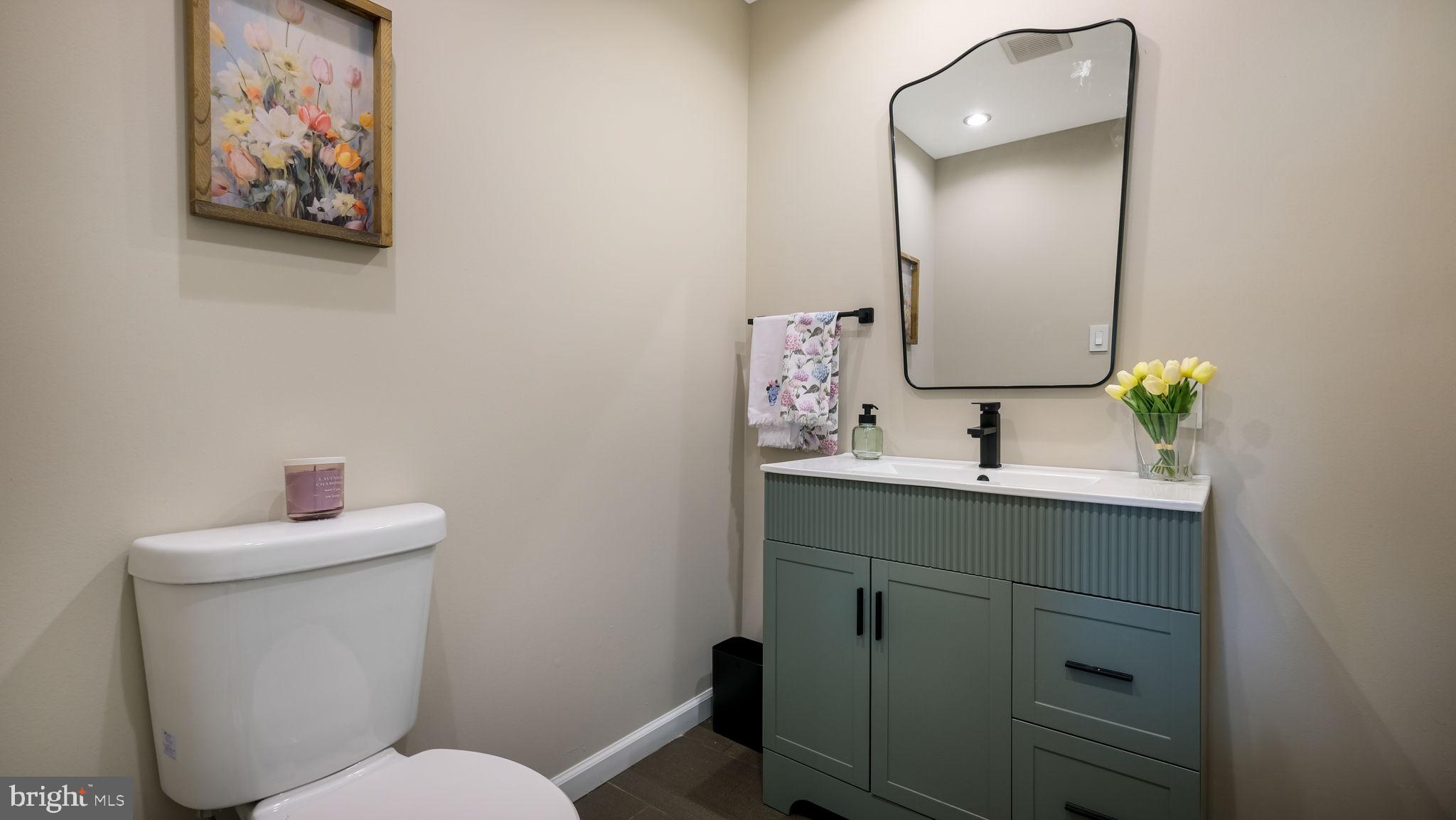 1341 Carol Road Jenkintown, PA 19046 - Photo 14 of 56 a bathroom with a toilet sink and mirror
