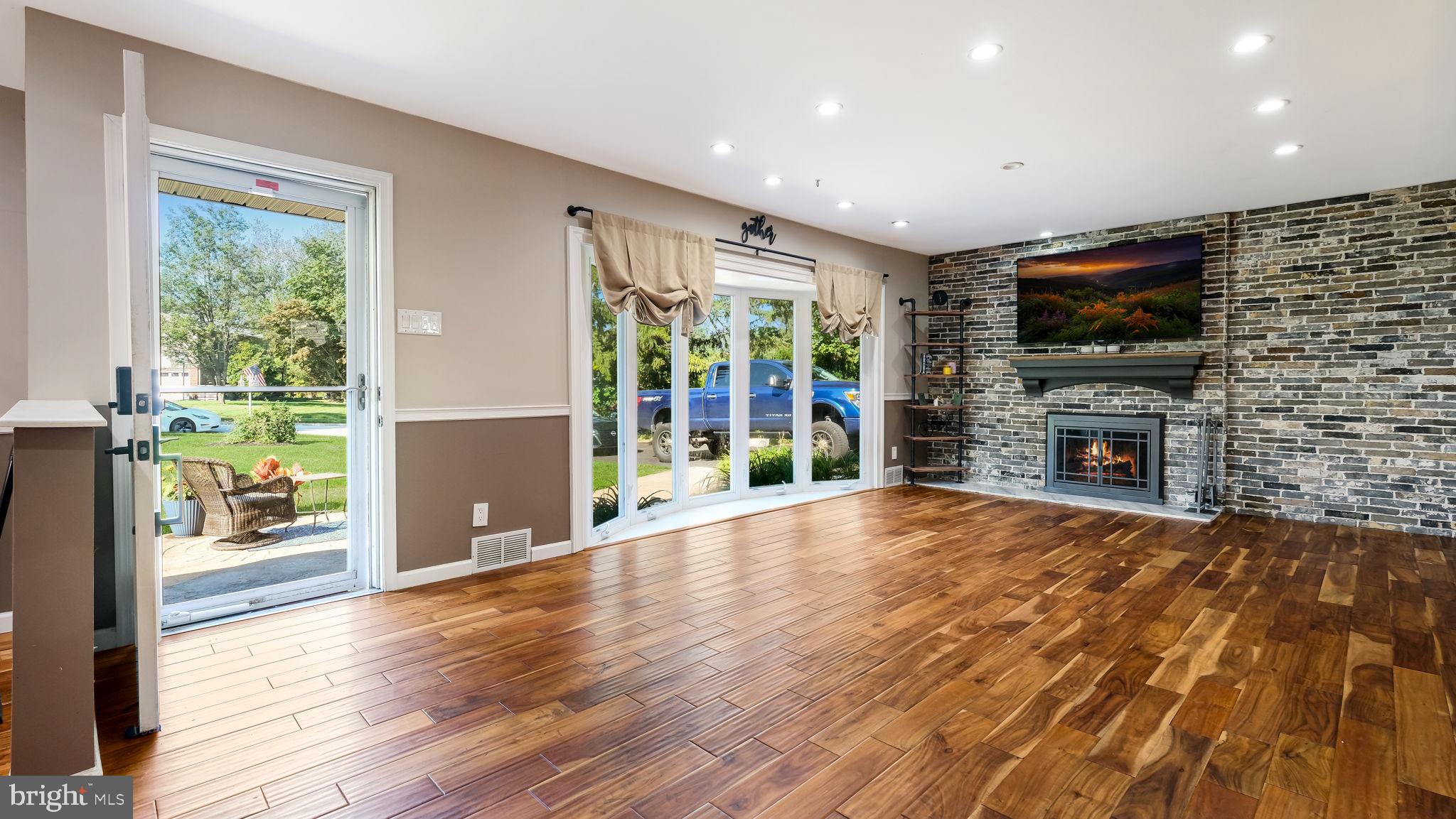 1341 Carol Road Jenkintown, PA 19046 - Photo 21 of 56 a view of empty room with wooden floor and fireplace