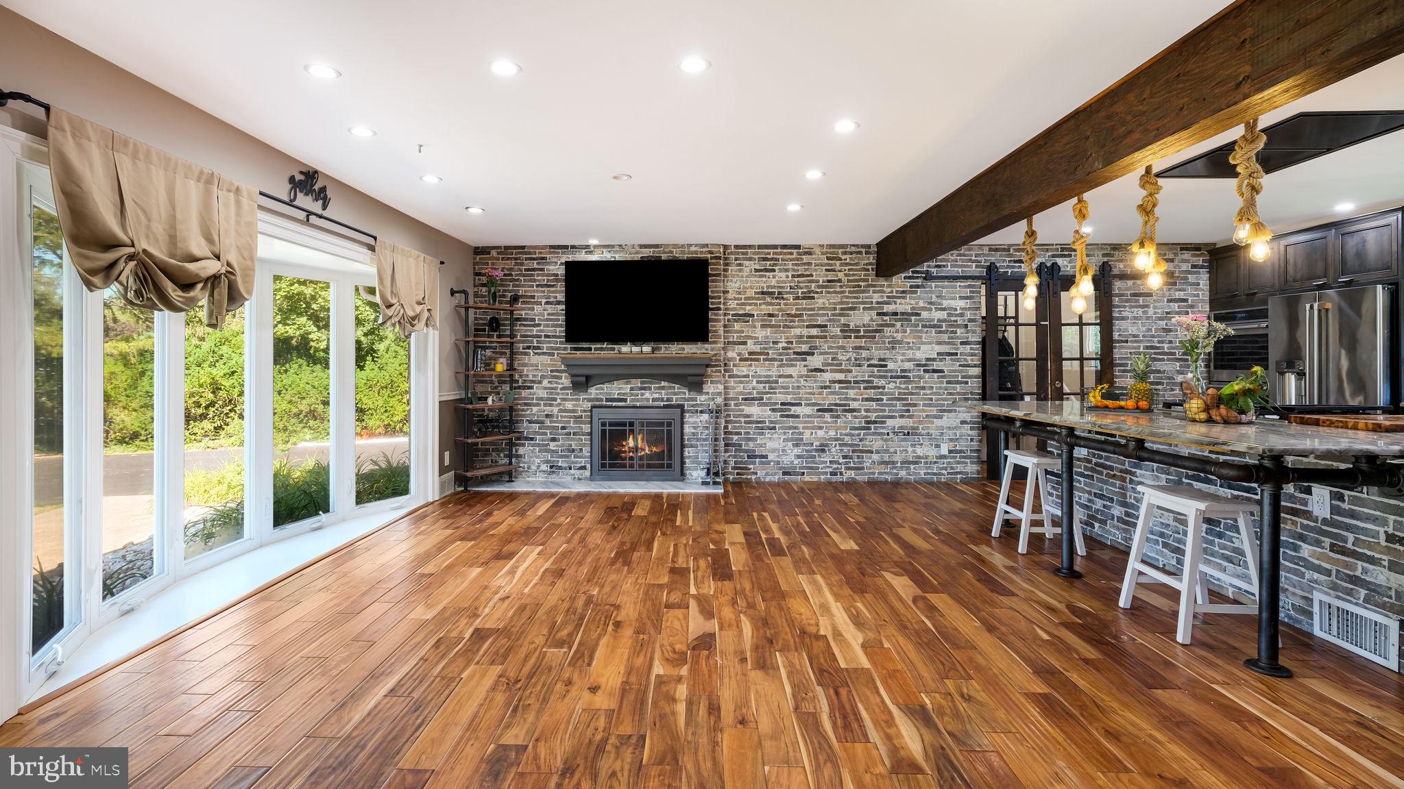 1341 Carol Road Jenkintown, PA 19046 - Photo 22 of 56 a living room with fireplace furniture and a flat screen tv