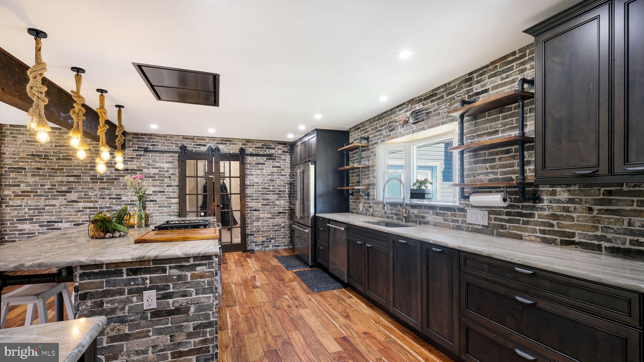 1341 Carol Road Jenkintown, PA 19046 - Photo 29 of 56 a kitchen with stainless steel appliances a sink stove and cabinets