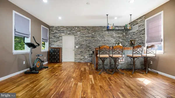 a view of hallway with wooden floor