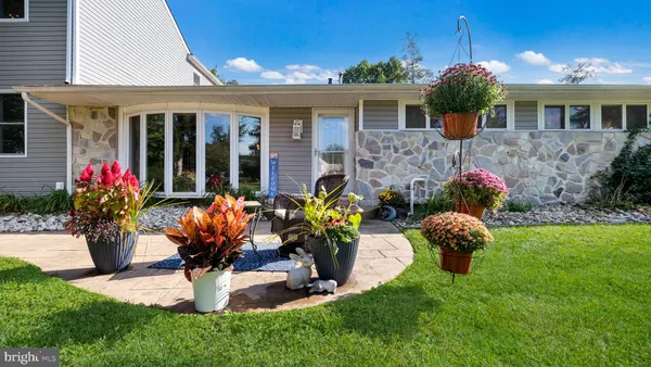 a front view of house with yard and outdoor seating