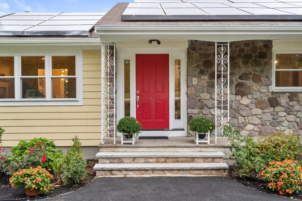 15 Pecunit Street Canton, MA 02021 - Photo 1 of 22 a front view of a house with a potted plant and a potted plant
